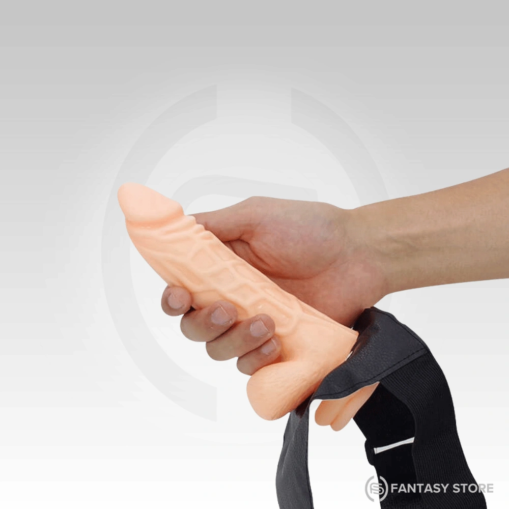 The realistic hollow dildo is shown in hand to emphasize its textured surface and comfortable grip, available with discreet delivery in Coimbatore.