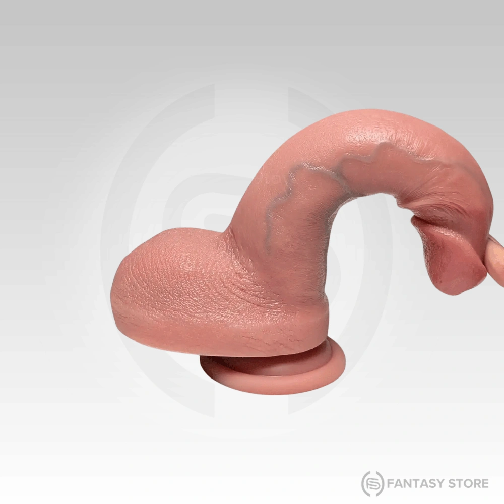 Flexible silicone dildo bent to demonstrate soft body-safe material and durability.