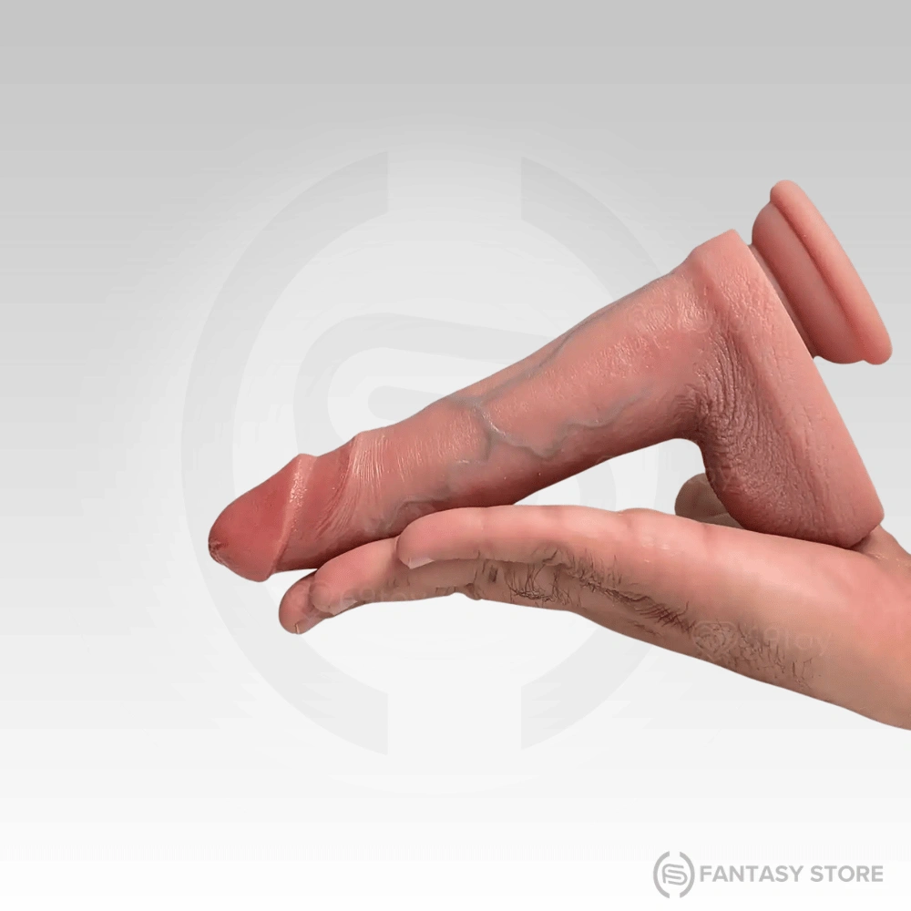 realistic-dildo-hand-size-comparison.webp Close-up of the realistic dildo head with detailed glans and natural skin texture.